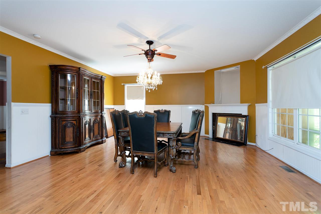 220 Mickleson Ridge Drive Raleigh, NC 27603 - Photo 4 of 20 a view of a dining room with furniture window and wooden floor