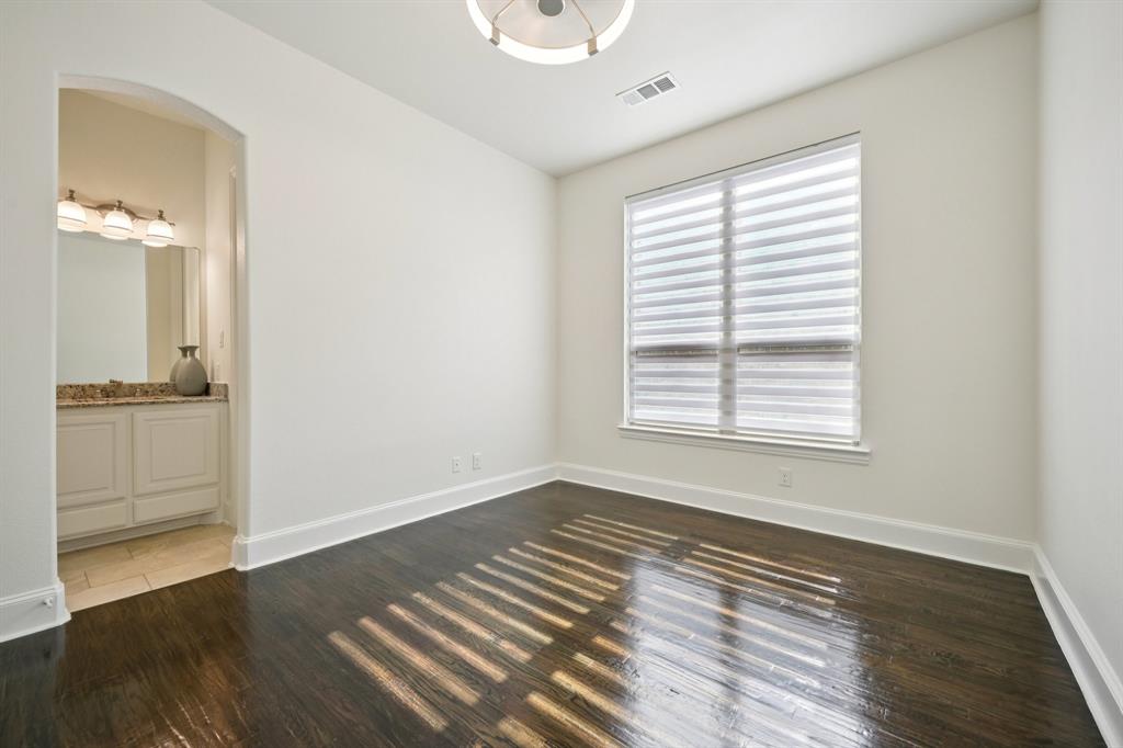 2029 Temperate Drive Allen, TX 75013 - Photo 17 of 40 an empty room with wooden floor and windows