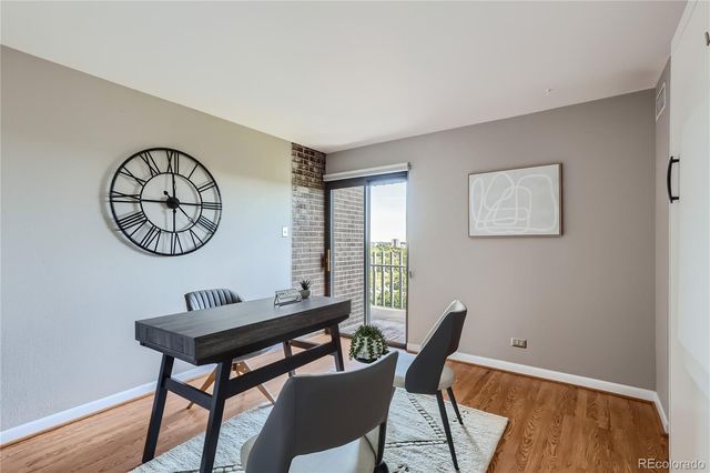 a view of a room that has a table and a chair
