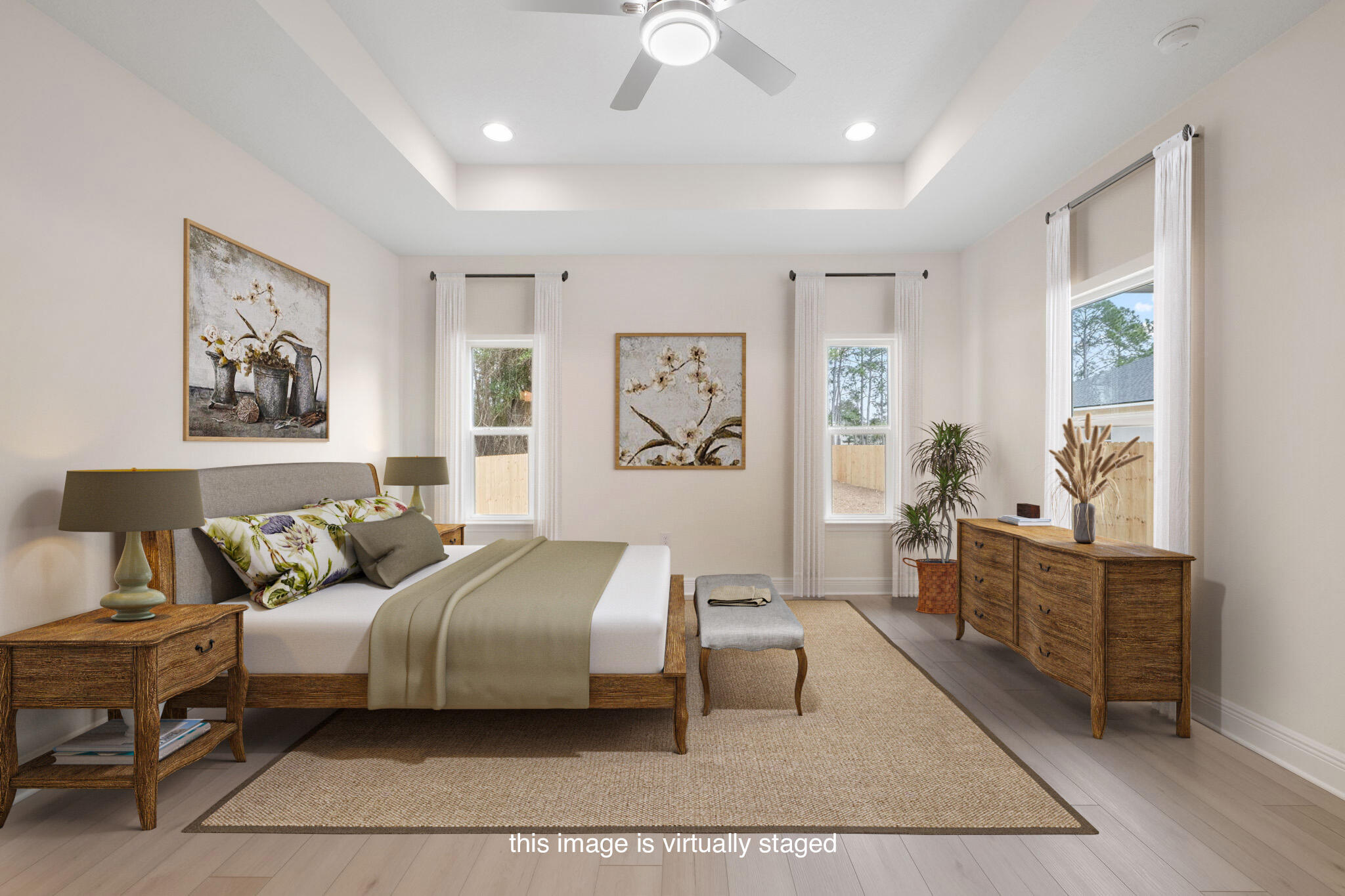 8370 Sevilla Street Navarre, FL 32566 - Photo 6 of 12 a spacious bedroom with a bed a couch and paintings on the wall