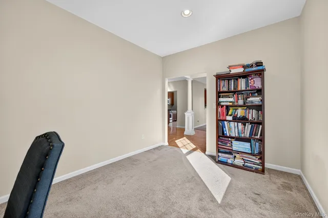 a view of a livingroom with a bookshelf