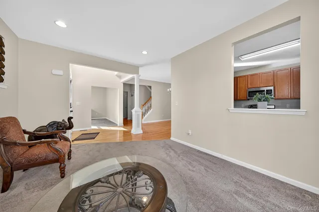 a living room with furniture and a window