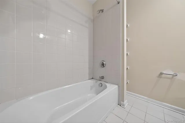 a white bath tub sitting in a bathroom