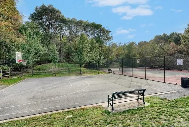 a park bench sitting in the middle of a park