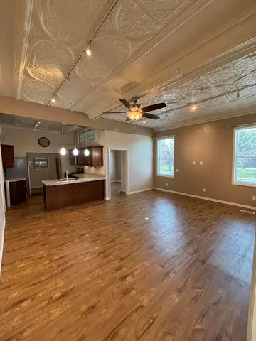 a view of a livingroom with a kitchen