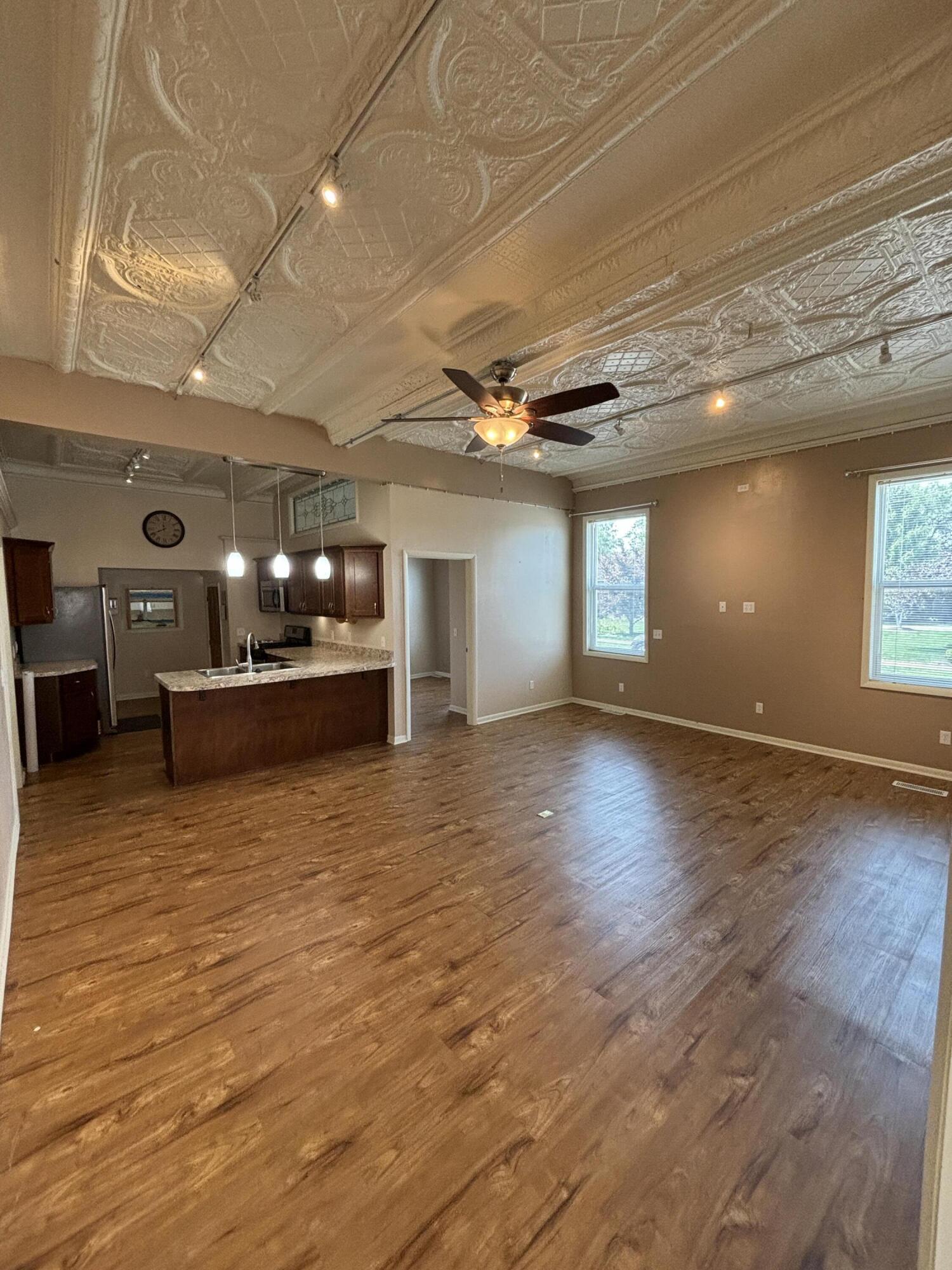 228 West Barker Avenue, Unit 1 Michigan City, IN 46360 - Photo 3 of 7 a view of a livingroom with a kitchen