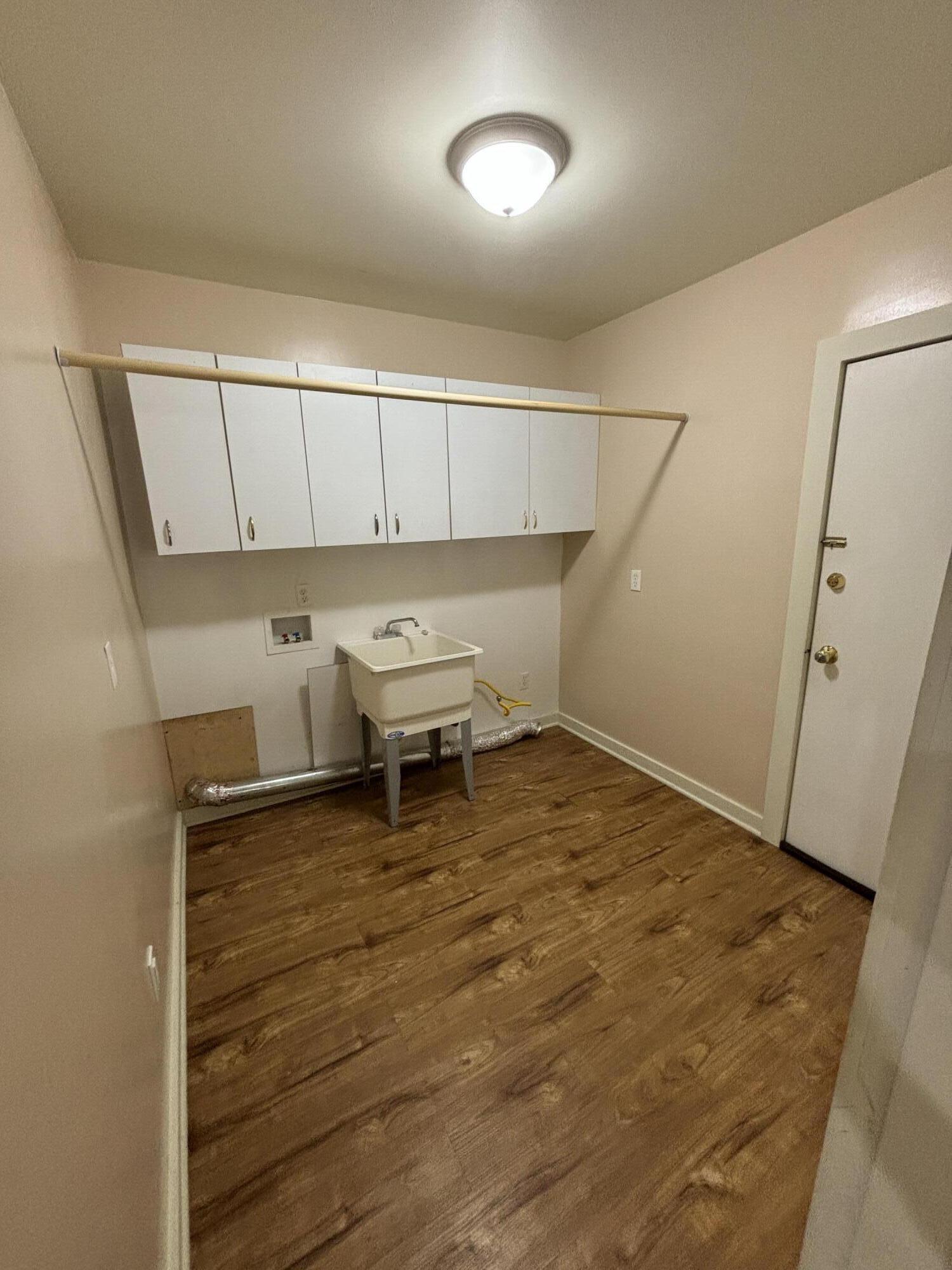 228 West Barker Avenue, Unit 1 Michigan City, IN 46360 - Photo 7 of 7 a view of a room with racks on the wall