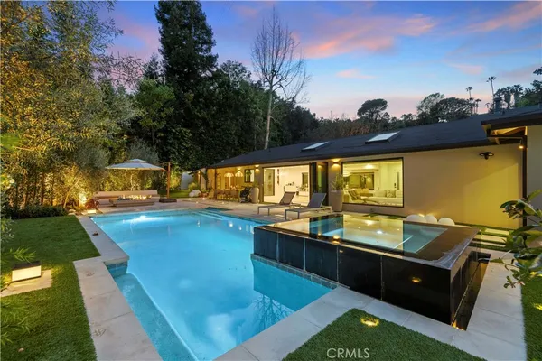 a view of swimming pool with seating area