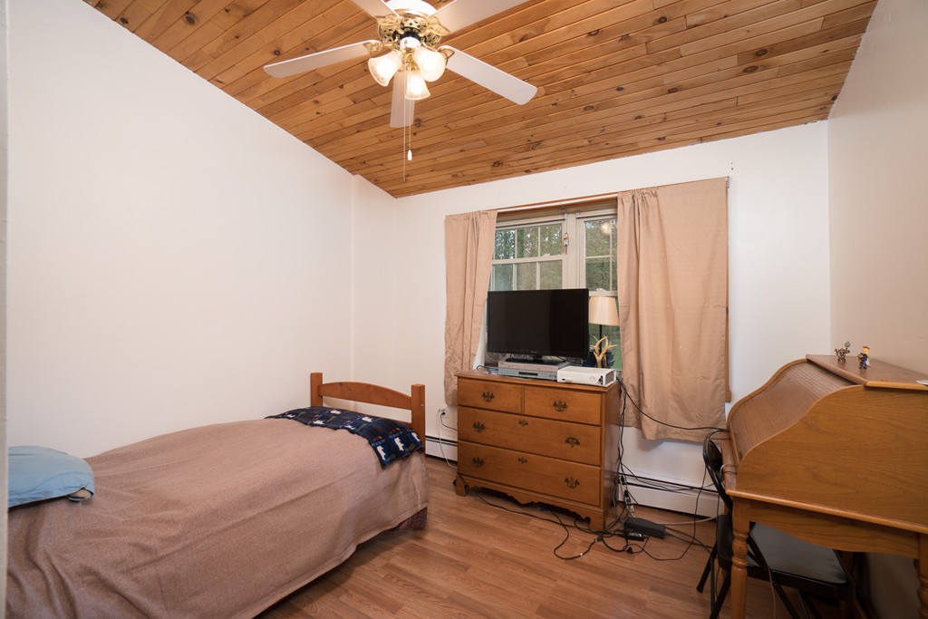 1537 Southbridge Road Warren, MA 01585 - Photo 12 of 30 a bedroom with a bed and a flat screen tv