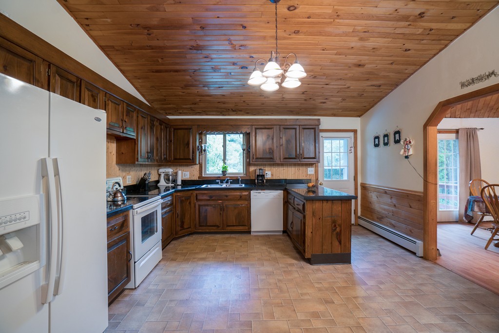 1537 Southbridge Road Warren, MA 01585 - Photo 3 of 30 a large kitchen with a large window and stainless steel appliances