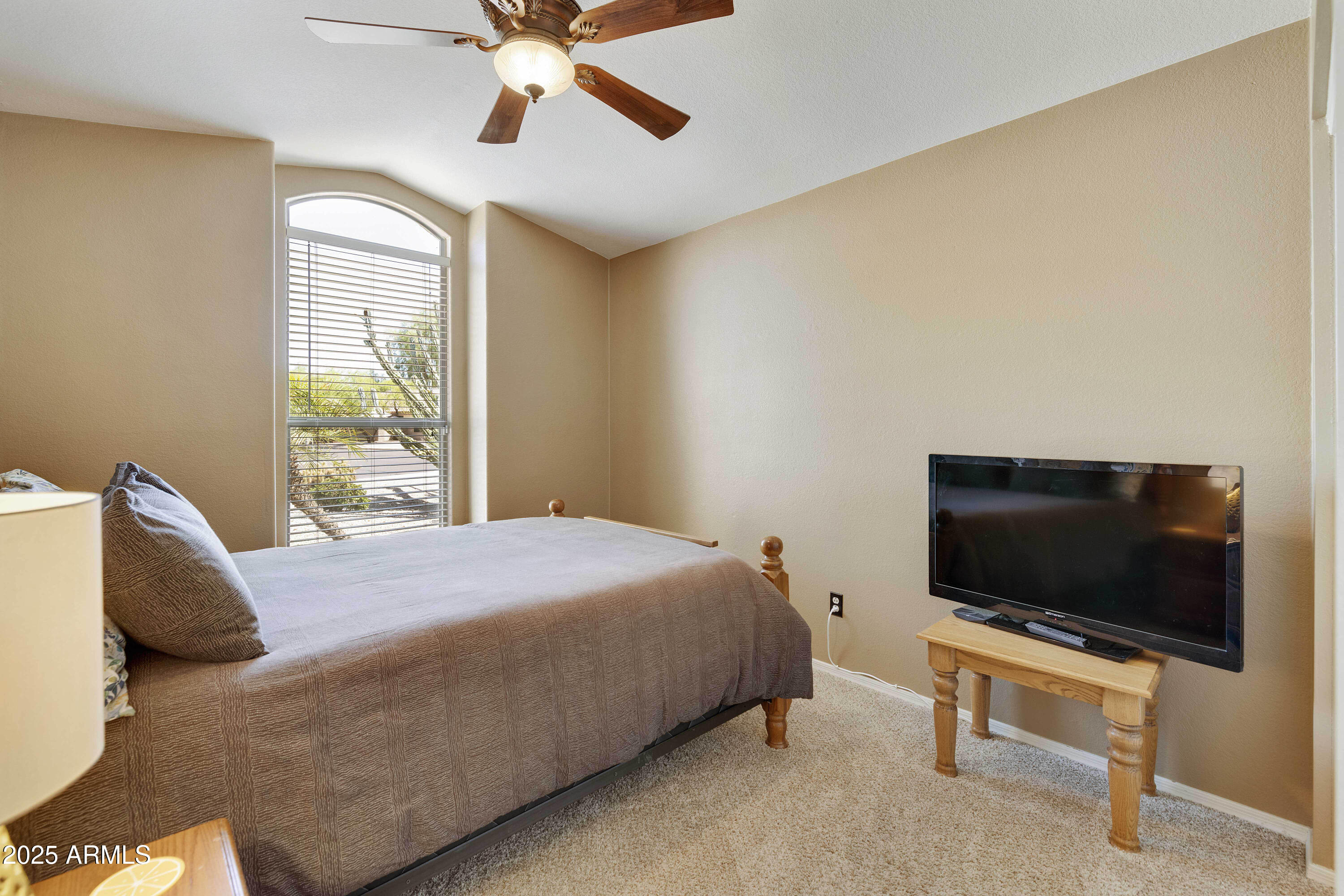 519 East Devon Drive Gilbert, AZ 85296 - Photo 17 of 47 a bedroom with a bed and a flat screen tv