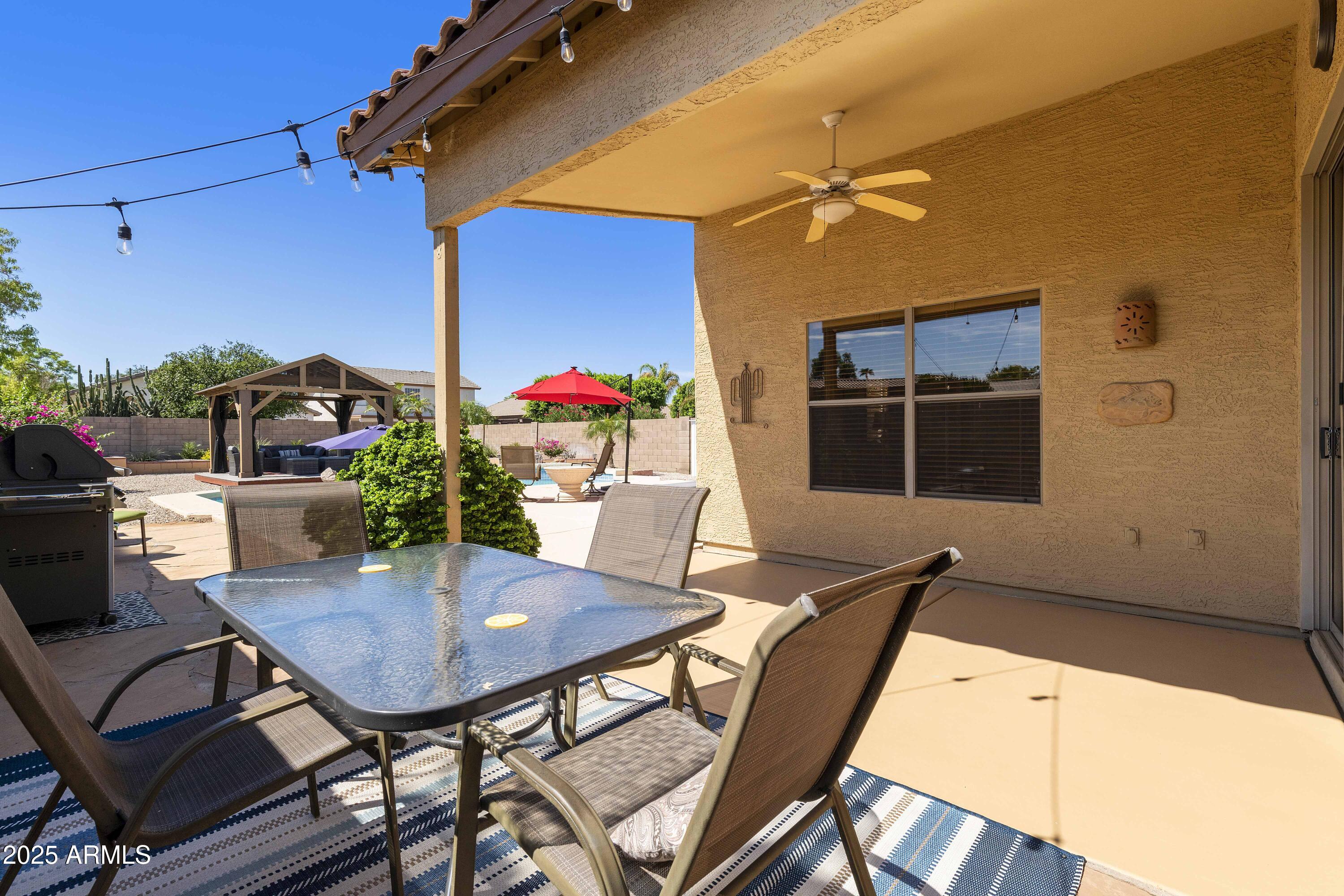 519 East Devon Drive Gilbert, AZ 85296 - Photo 19 of 47 a table and chairs in front of a door