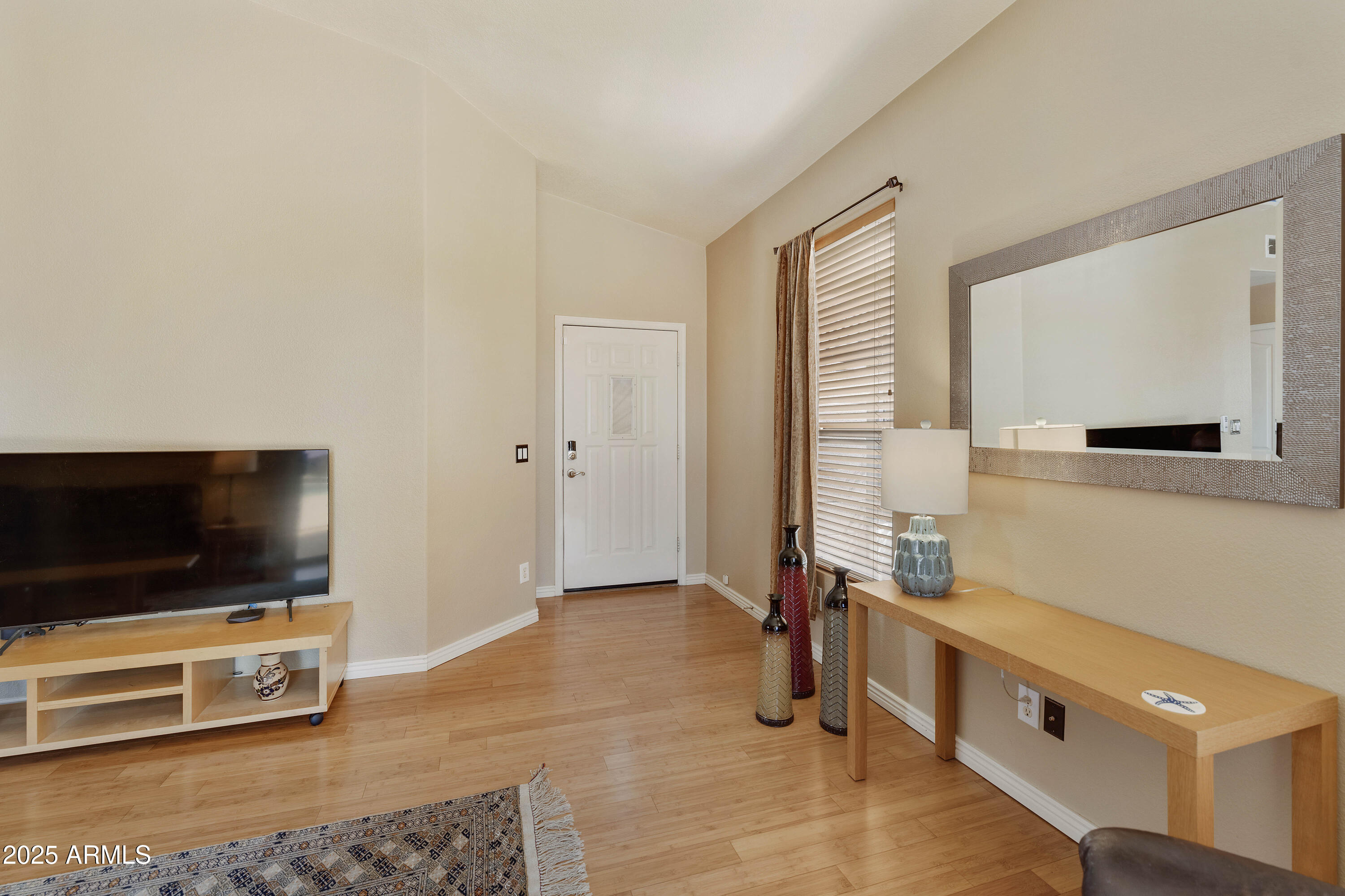 519 East Devon Drive Gilbert, AZ 85296 - Photo 30 of 47 a living room with furniture and a flat screen tv