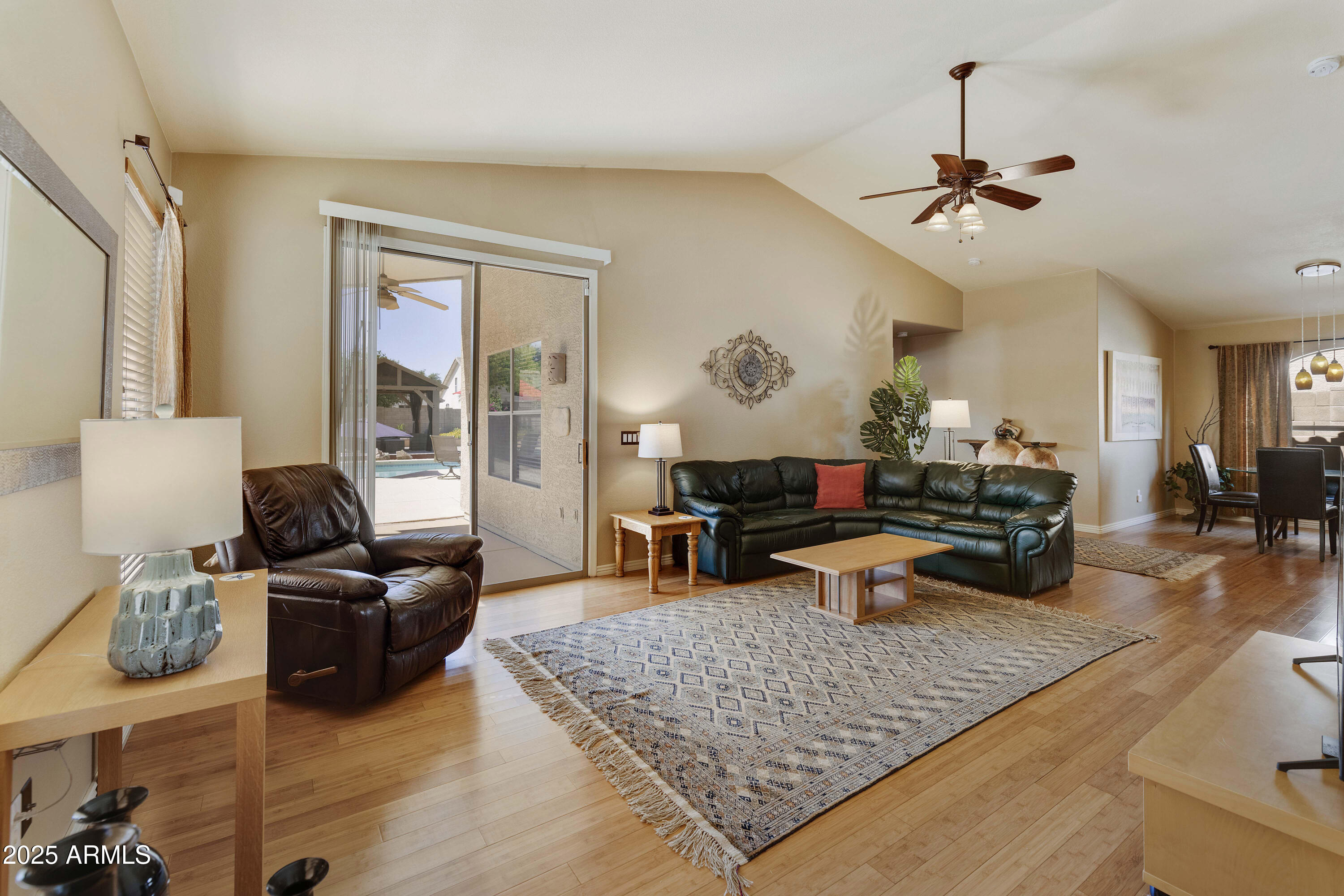 519 East Devon Drive Gilbert, AZ 85296 - Photo 31 of 47 a living room with furniture and wooden floor