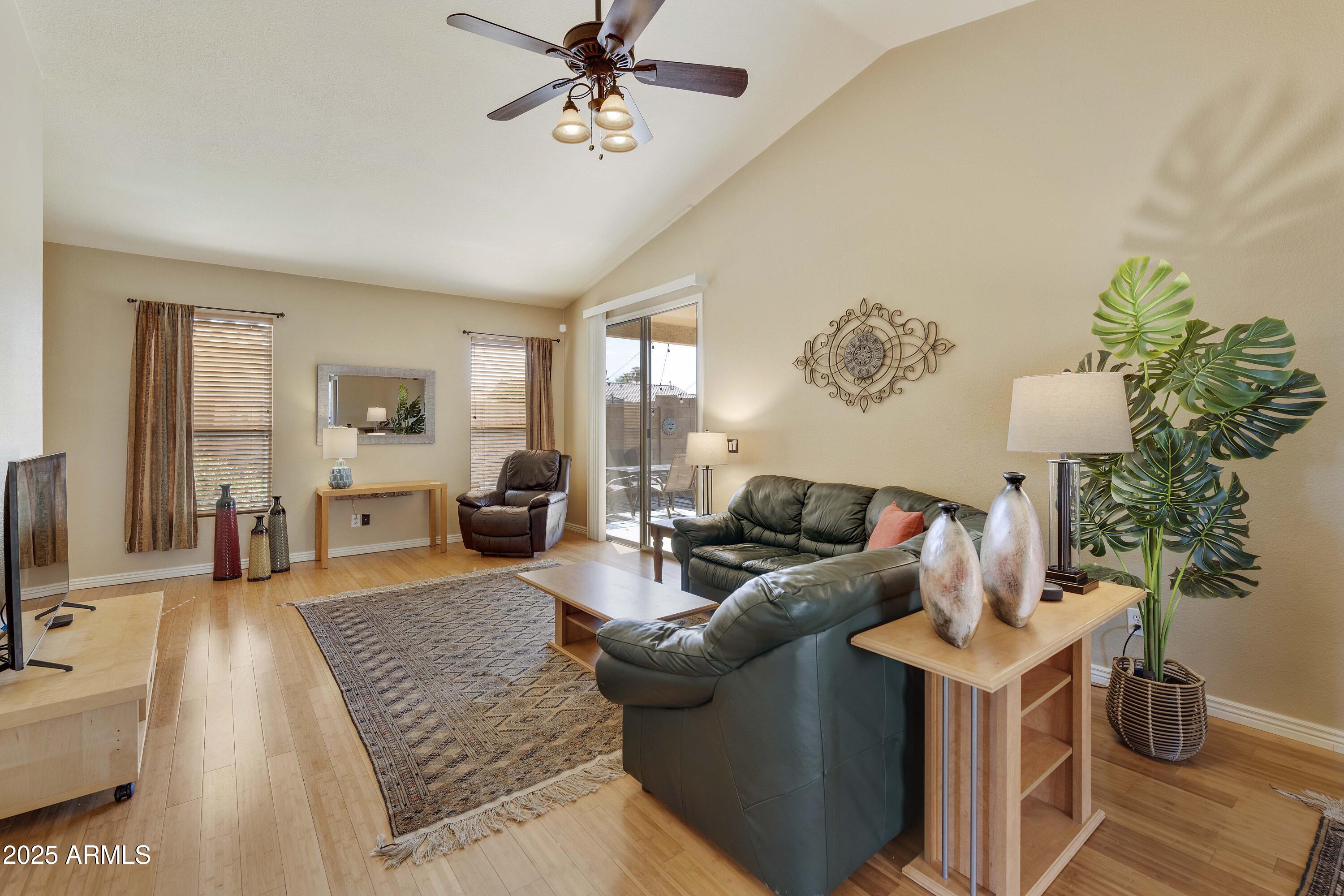 519 East Devon Drive Gilbert, AZ 85296 - Photo 32 of 47 a living room with furniture and a flat screen tv