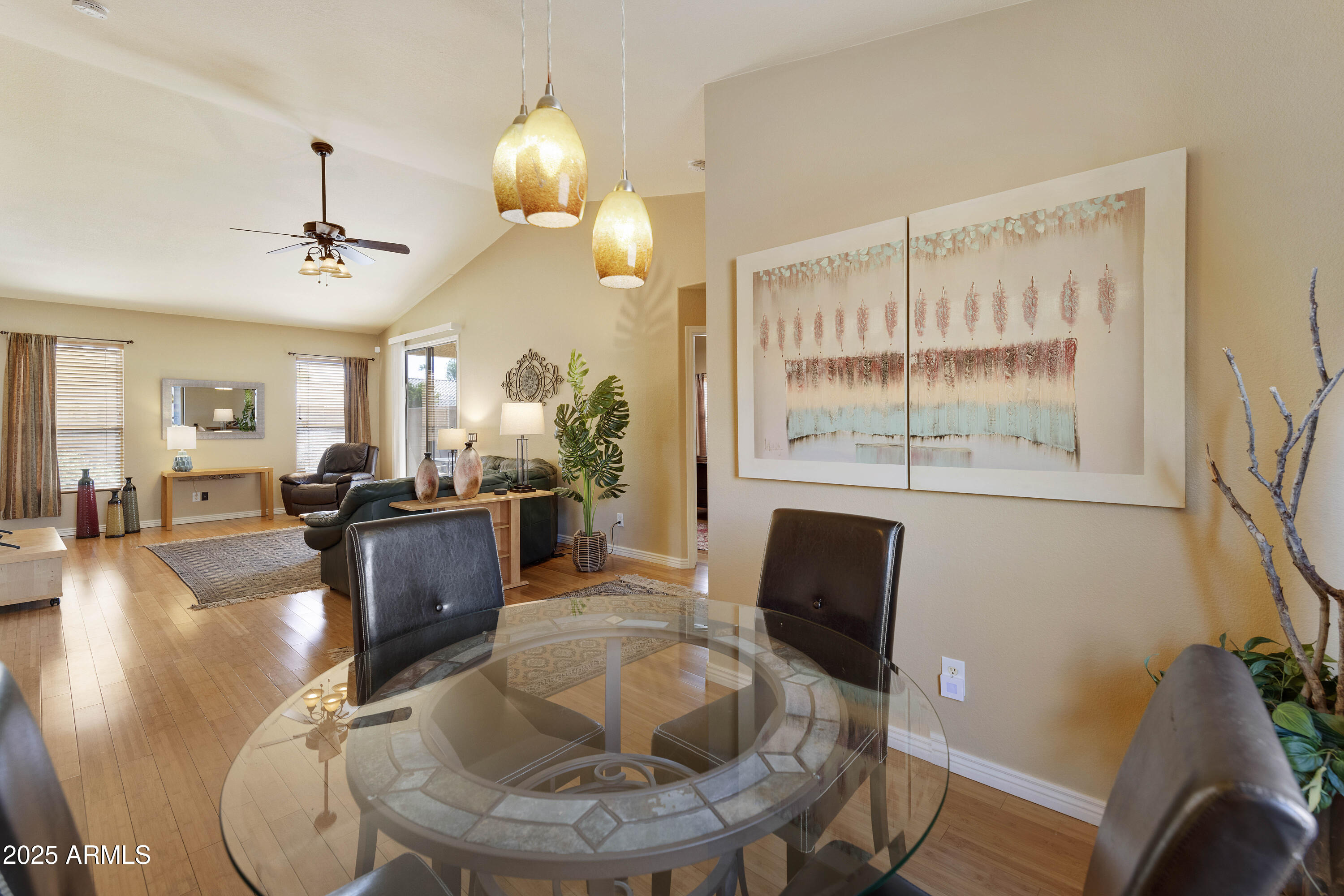 519 East Devon Drive Gilbert, AZ 85296 - Photo 34 of 47 a living room with couches chairs and a large window with wooden floor