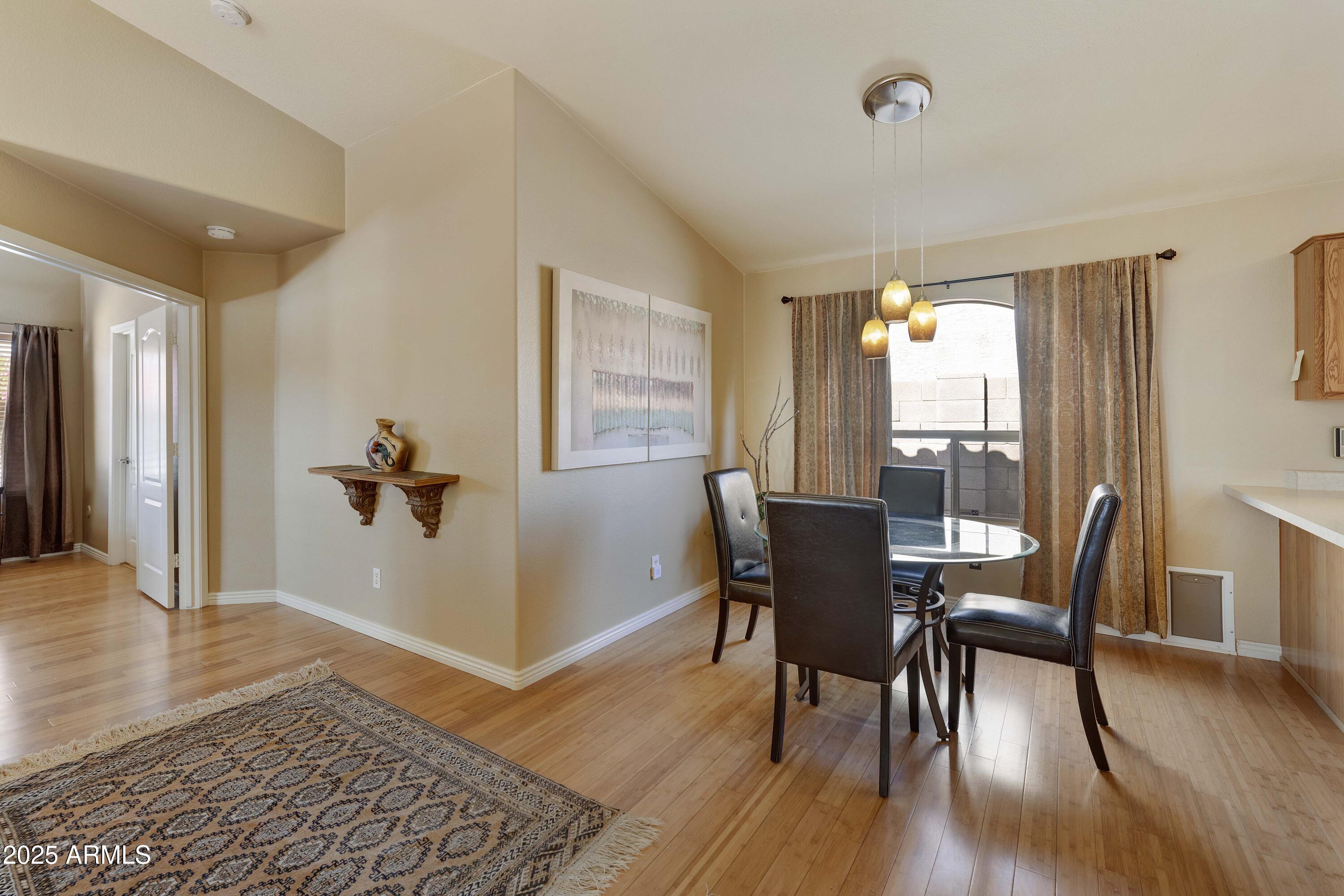 519 East Devon Drive Gilbert, AZ 85296 - Photo 35 of 47 a view of a dining room with furniture and wooden floor