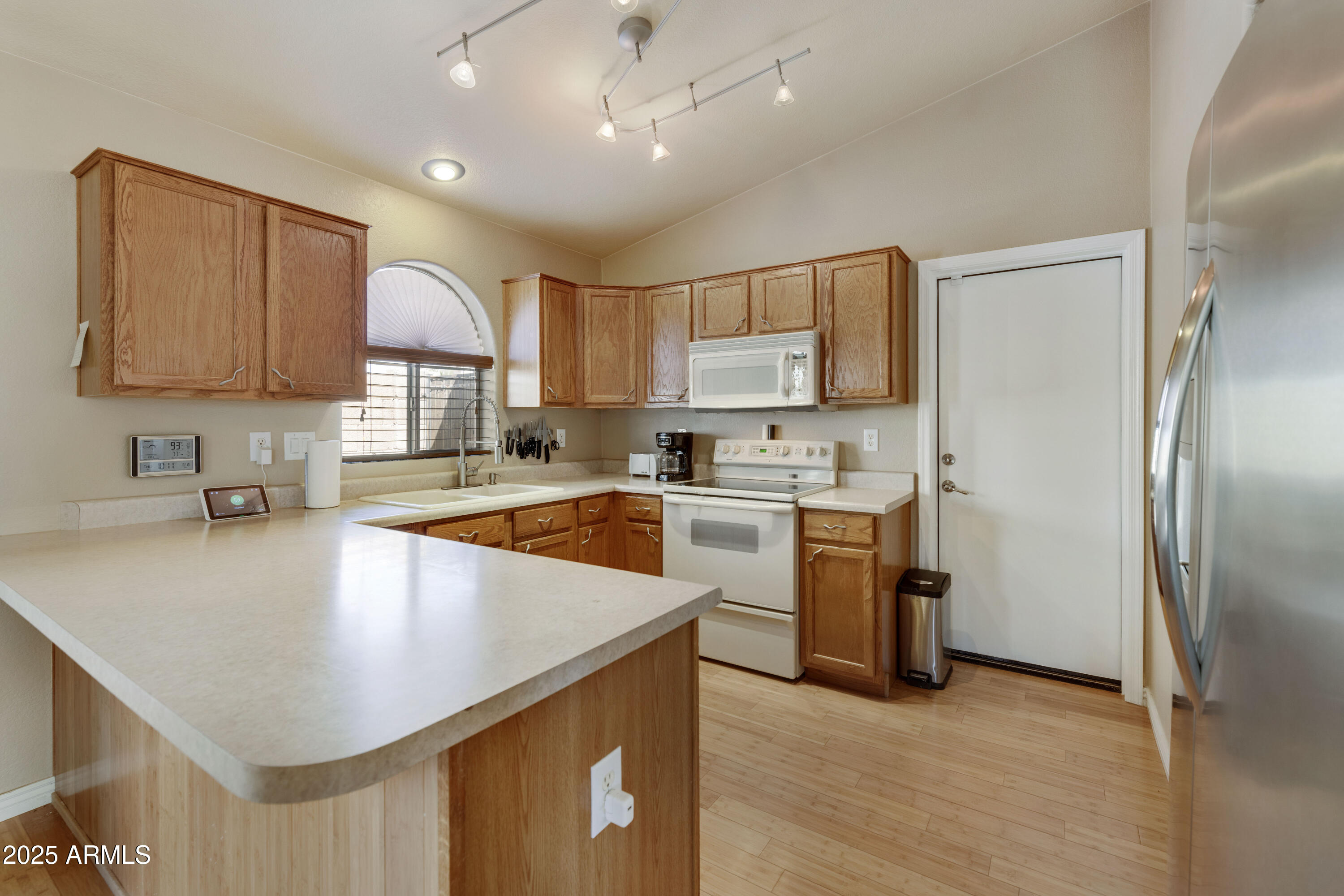 519 East Devon Drive Gilbert, AZ 85296 - Photo 38 of 47 a kitchen with refrigerator cabinets and a sink