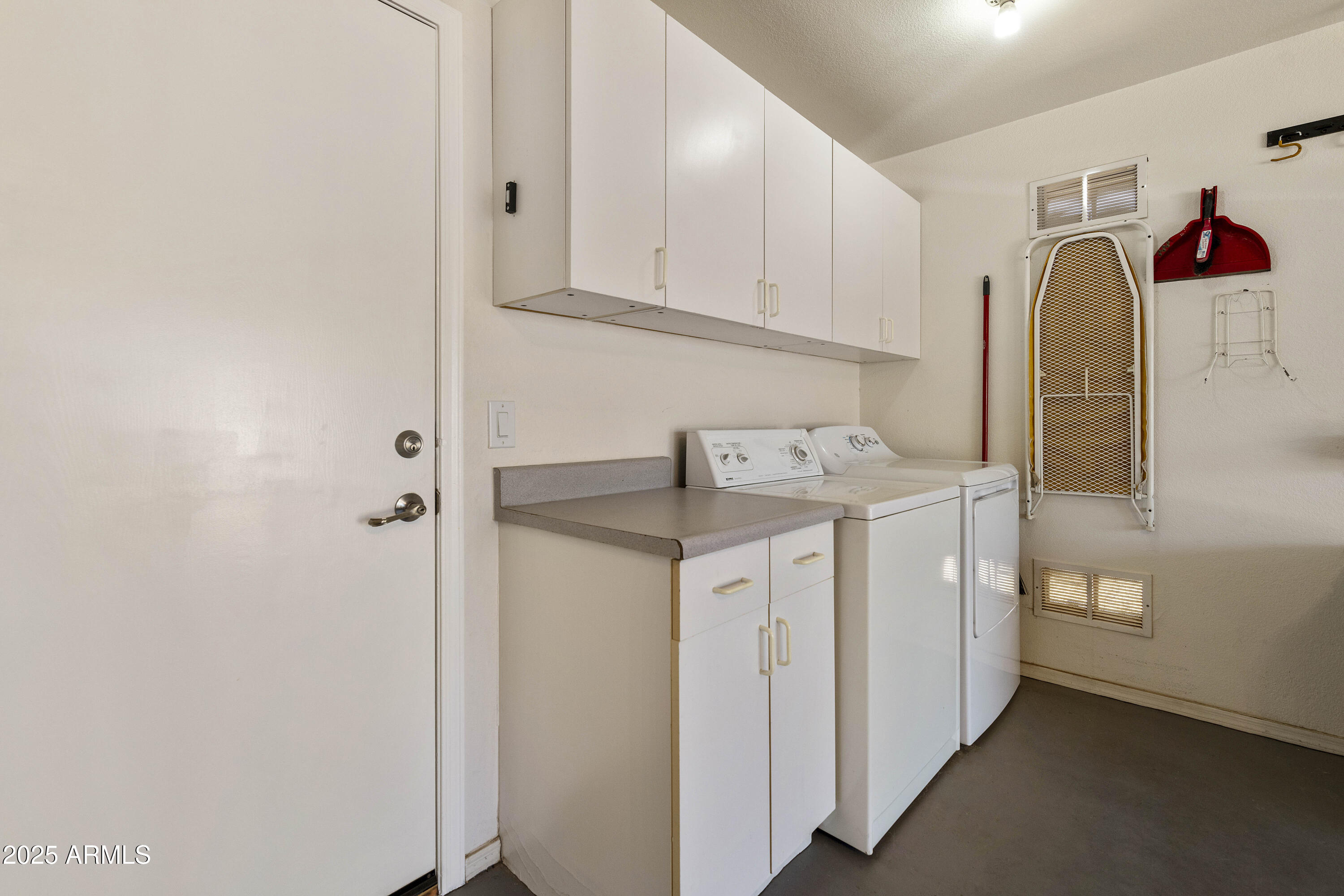 519 East Devon Drive Gilbert, AZ 85296 - Photo 4 of 47 a utility room with cabinets washer and dryer