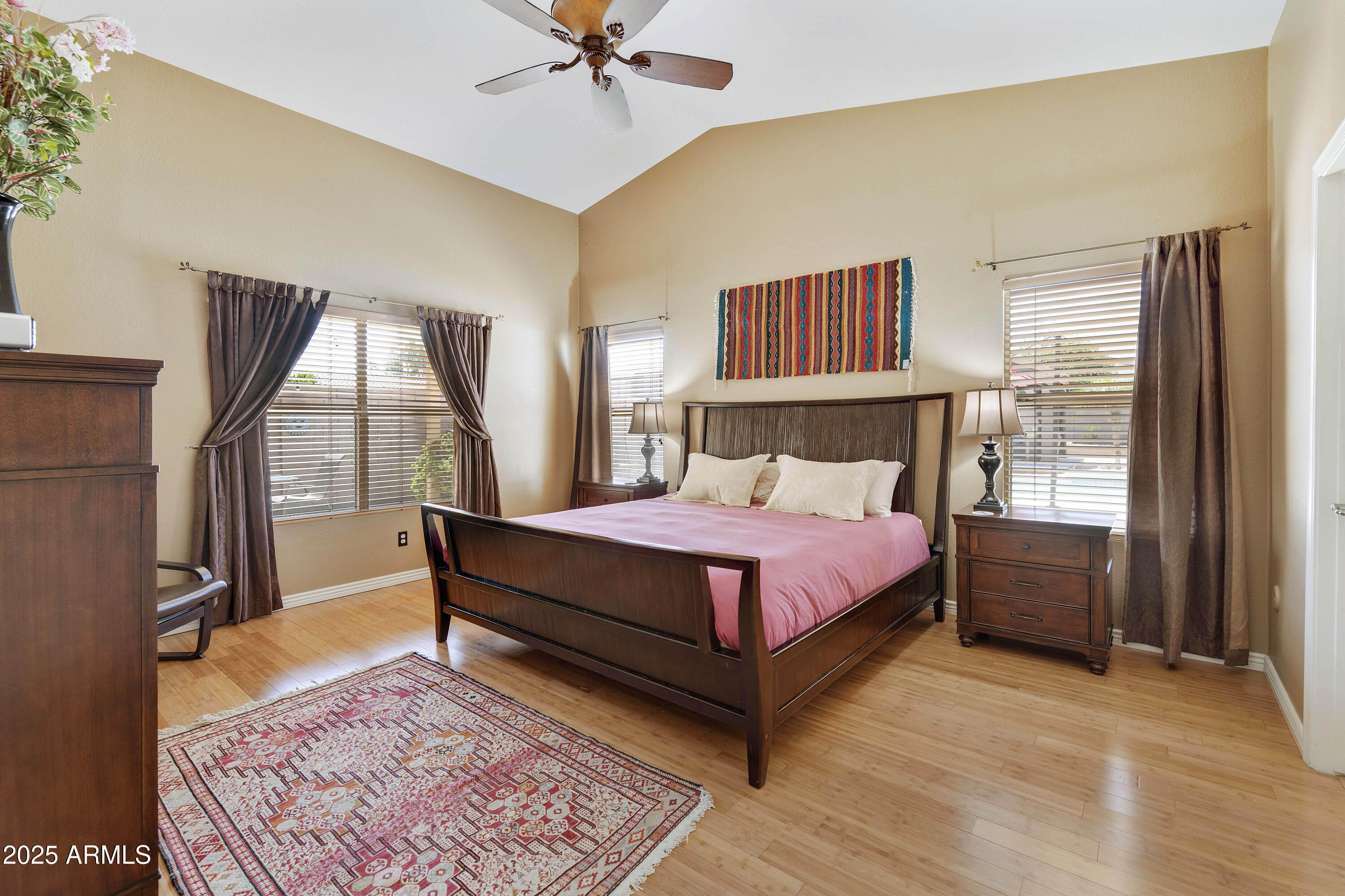 519 East Devon Drive Gilbert, AZ 85296 - Photo 41 of 47 a bedroom with a bed and wooden floor