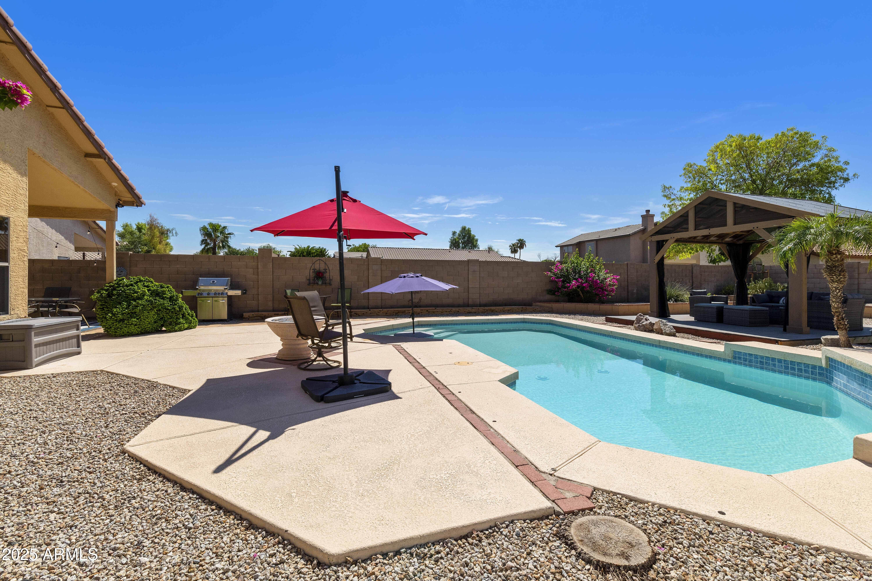 519 East Devon Drive Gilbert, AZ 85296 - Photo 6 of 47 a view of a swimming pool with a patio