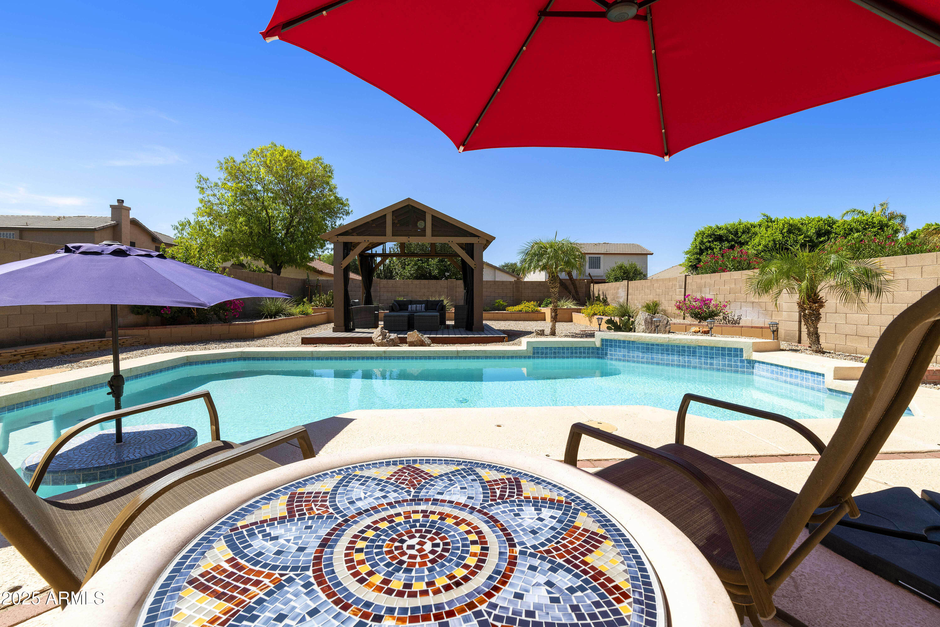 519 East Devon Drive Gilbert, AZ 85296 - Photo 9 of 47 a front view of a house with garden