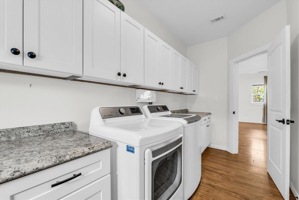 348 Barker Lane Waco, TX 76705 - Photo 7 of 39 a view of a storage and utility room with washer and dryer