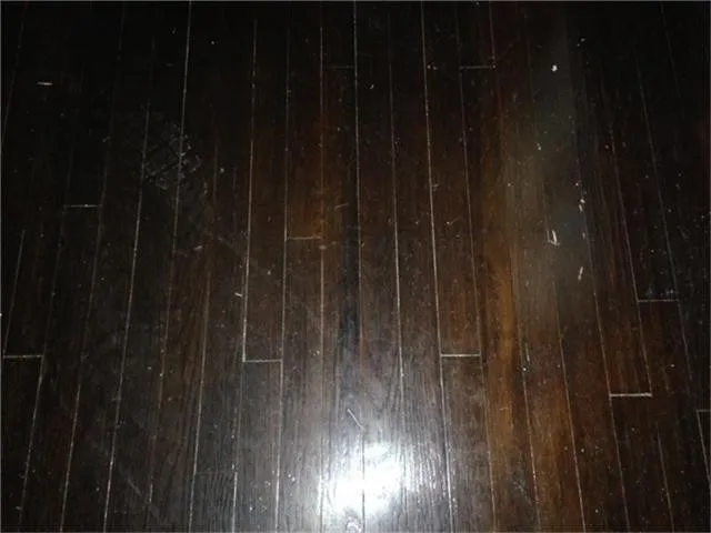 a bathroom with a shower and wooden door