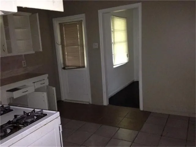 a kitchen with a stove and a refrigerator