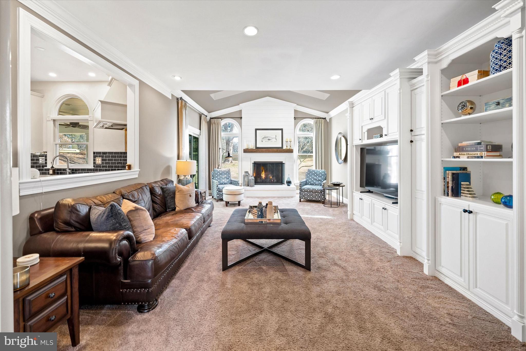 716 Regency Hill Road Hockessin, DE 19707 - Photo 16 of 73 a living room with furniture fireplace and a large window