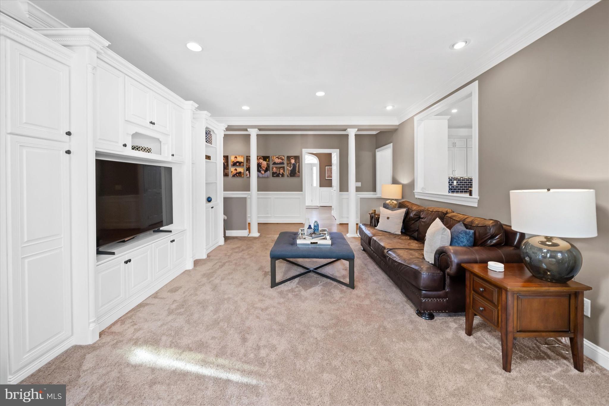 716 Regency Hill Road Hockessin, DE 19707 - Photo 17 of 73 a living room with furniture and a flat screen tv