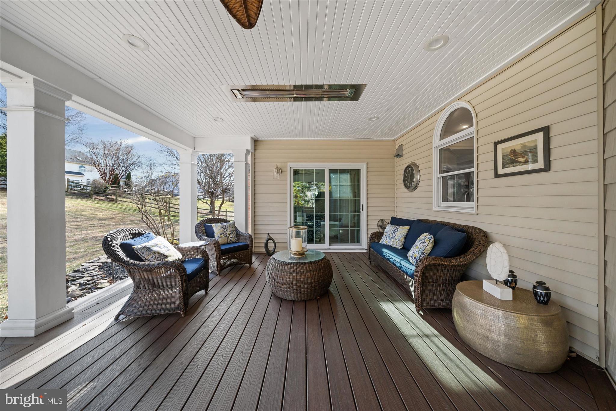 716 Regency Hill Road Hockessin, DE 19707 - Photo 35 of 73 a living room with furniture and floor to ceiling windows