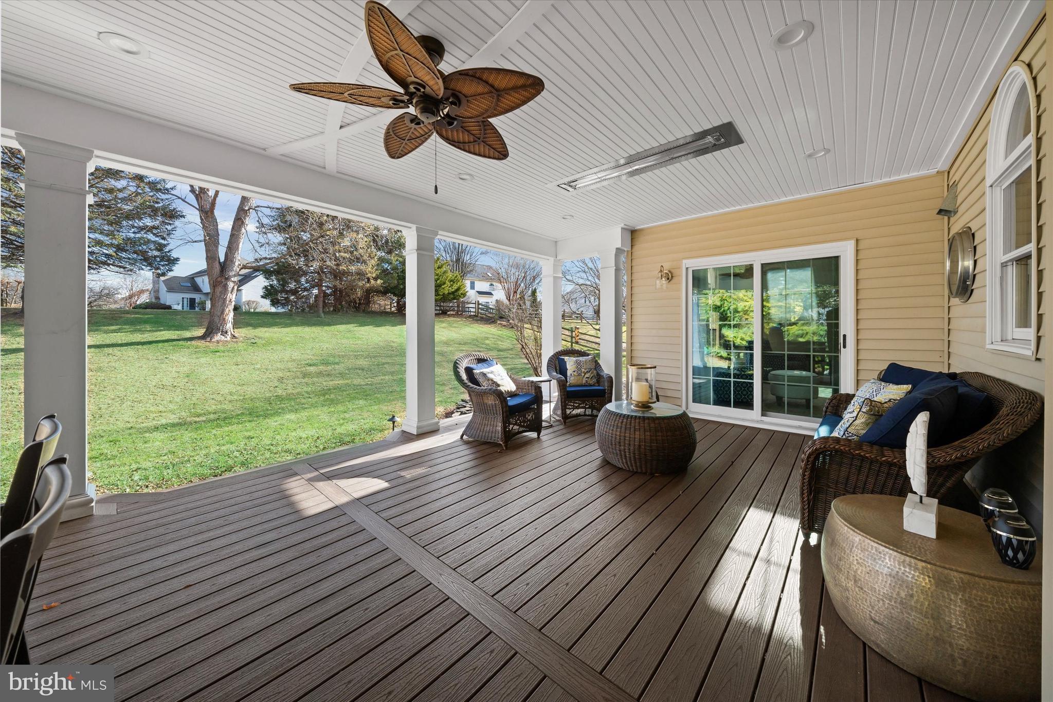 716 Regency Hill Road Hockessin, DE 19707 - Photo 37 of 73 a living room with couch floor to ceiling window yard view and a floor to ceiling window