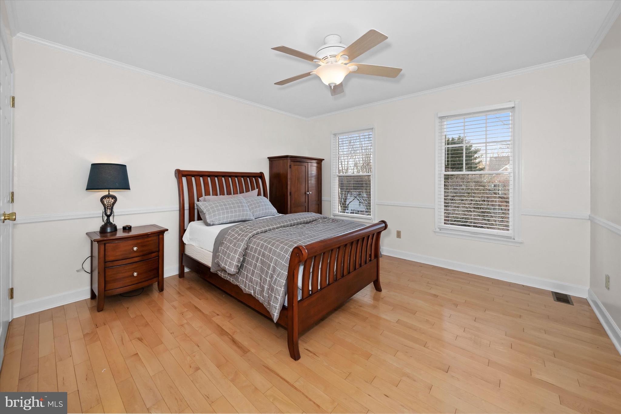 716 Regency Hill Road Hockessin, DE 19707 - Photo 47 of 73 a bedroom with a bed window and a ceiling fan