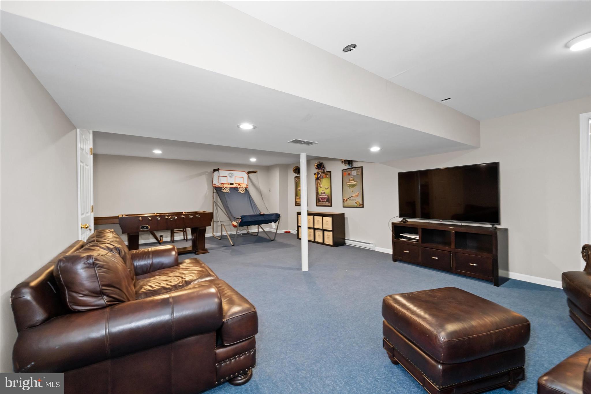 716 Regency Hill Road Hockessin, DE 19707 - Photo 53 of 73 a living room with furniture and a flat screen tv