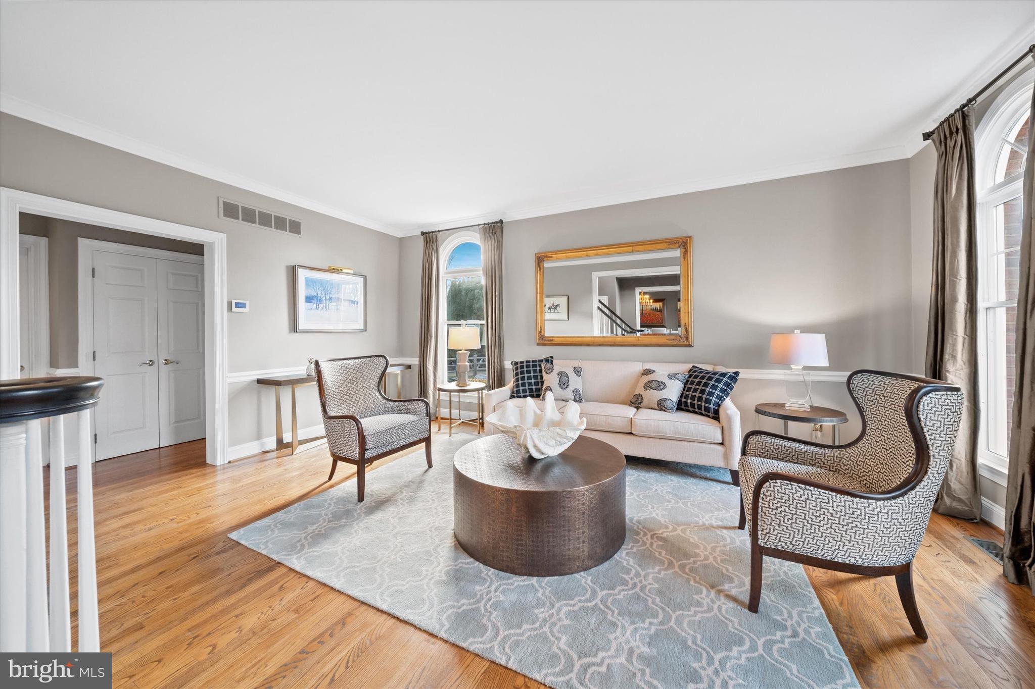 716 Regency Hill Road Hockessin, DE 19707 - Photo 9 of 73 a living room with furniture and a wooden floor