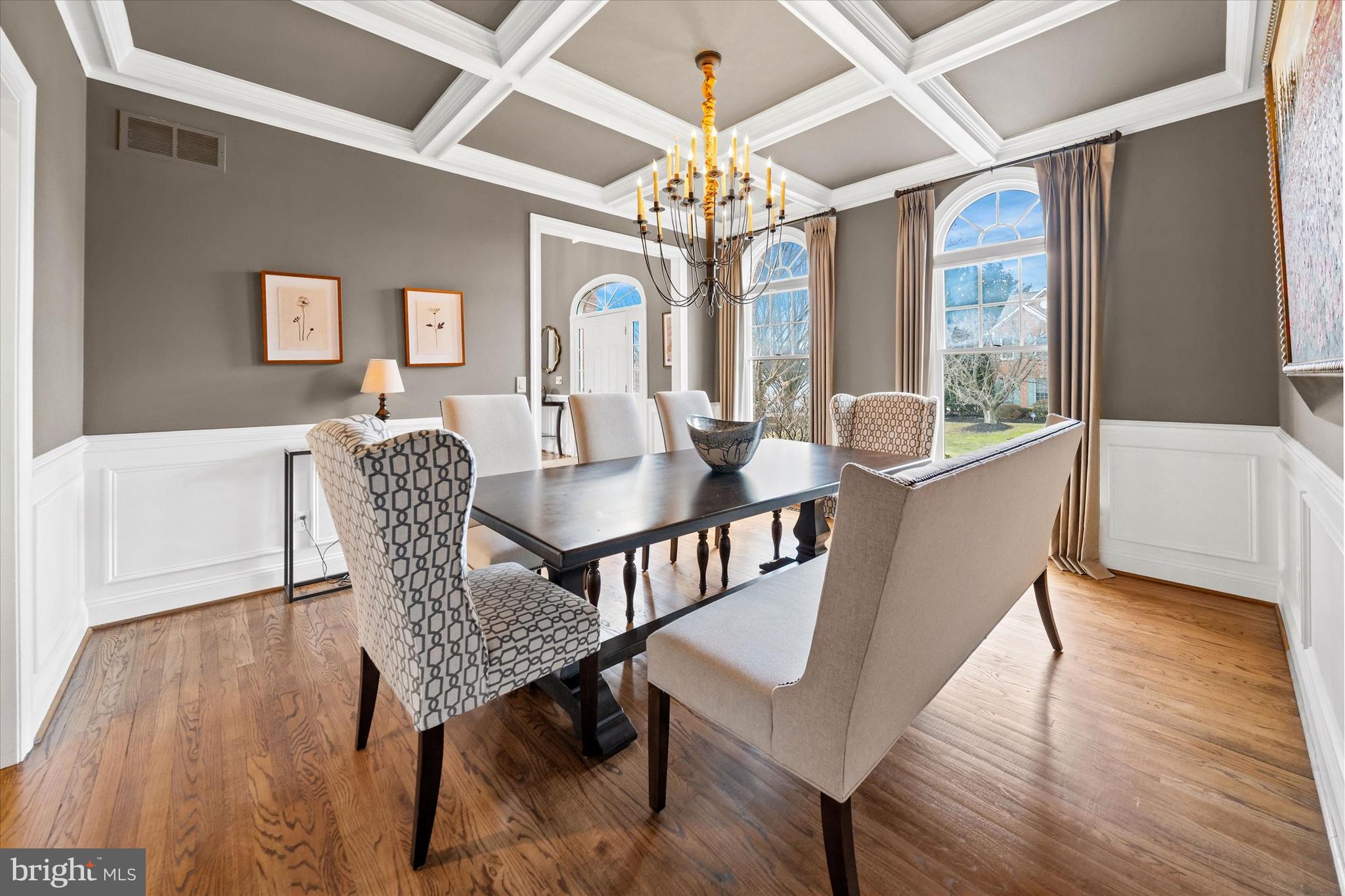 716 Regency Hill Road Hockessin, DE 19707 - Photo 10 of 73 a dining room with furniture a chandelier and wooden floor