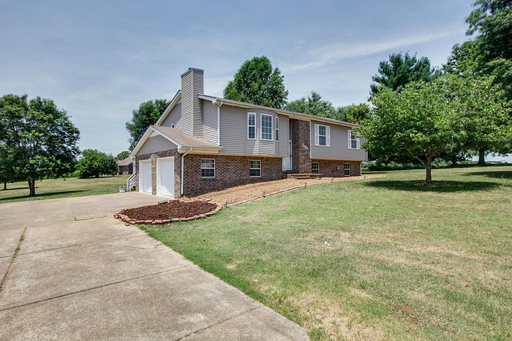 2199 Clara Mathis Road Spring Hill, TN 37174 - Photo 1 of 24 a front view of a house with a yard