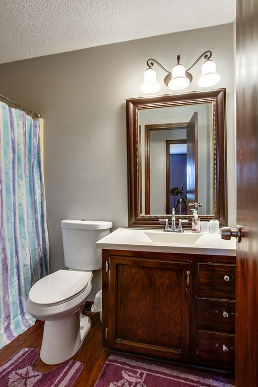2199 Clara Mathis Road Spring Hill, TN 37174 - Photo 11 of 24 a bathroom with a toilet sink and mirror