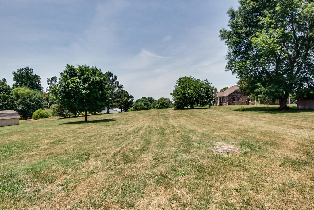 2199 Clara Mathis Road Spring Hill, TN 37174 - Photo 19 of 24 a view of a field with trees in the background