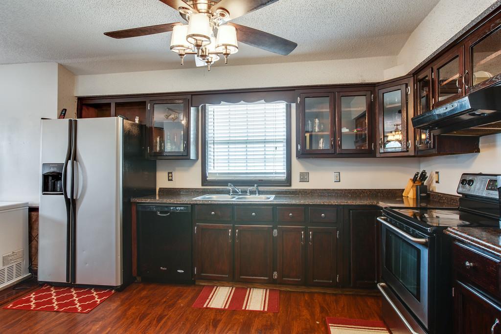 2199 Clara Mathis Road Spring Hill, TN 37174 - Photo 3 of 24 a kitchen with stainless steel appliances granite countertop a sink stove and refrigerator