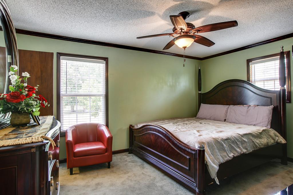 2199 Clara Mathis Road Spring Hill, TN 37174 - Photo 7 of 24 a bedroom with a bed and a chandelier