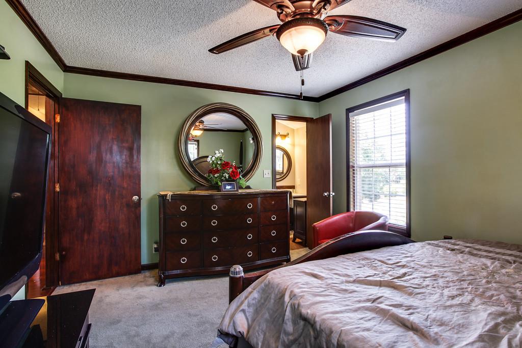 2199 Clara Mathis Road Spring Hill, TN 37174 - Photo 8 of 24 a bedroom with a bed and a large window