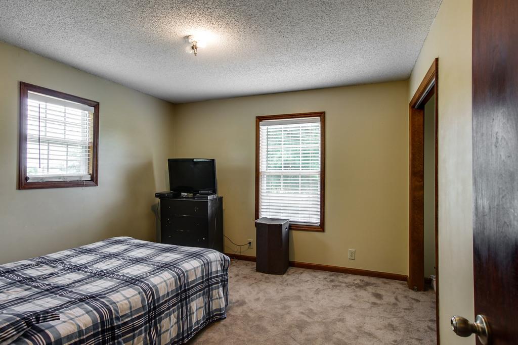 2199 Clara Mathis Road Spring Hill, TN 37174 - Photo 10 of 24 a bedroom with a bed and a television