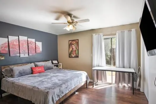 a bedroom with a large bed and a window