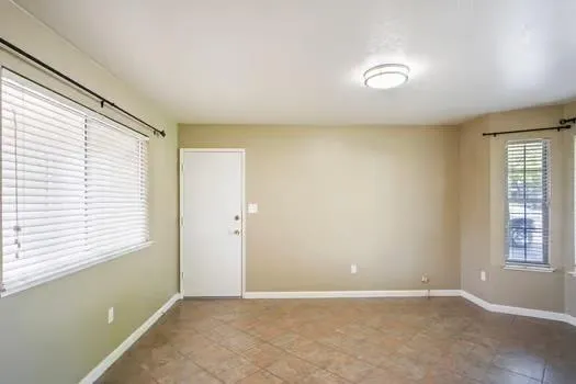 an empty room with windows