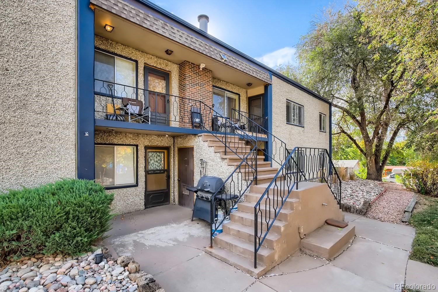 6190 Webster Street Arvada, CO 80003 - Photo 2 of 11 a view of a building with a patio