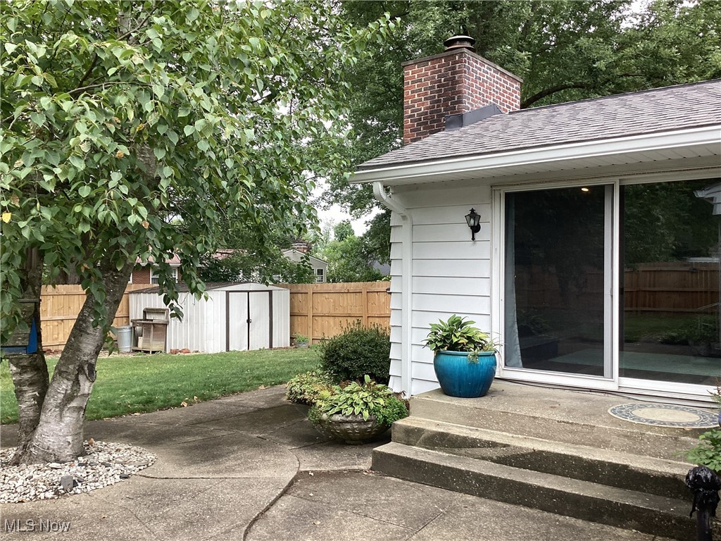 3009 Chamberlain Road Akron, OH 44333 - Photo 20 of 20 A glimpse of the shed, Tree and fence from the family room steps.