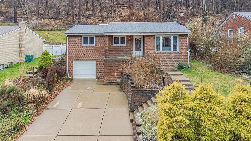 549 Filmore Road Pittsburgh, PA 15221 - Photo 1 of 25 a front view of a house with garden