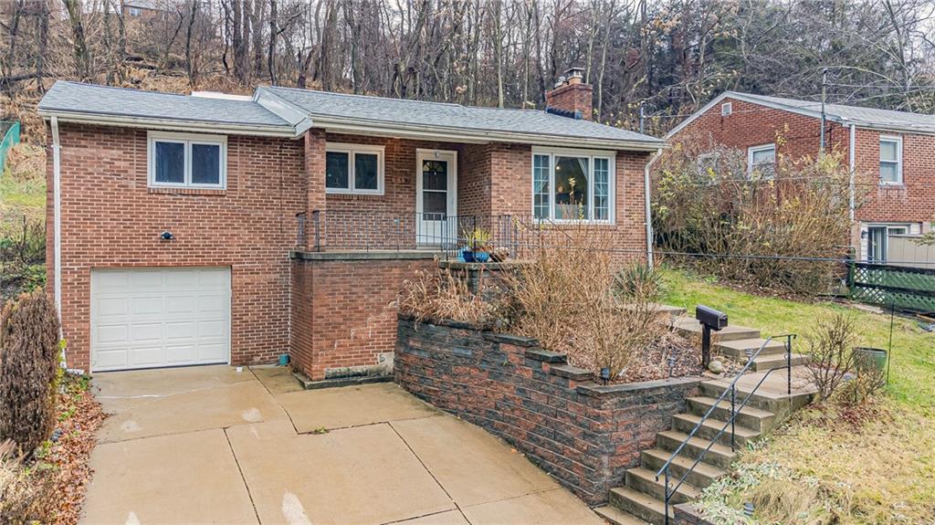 549 Filmore Road Pittsburgh, PA 15221 - Photo 2 of 25 a front view of a house with garden